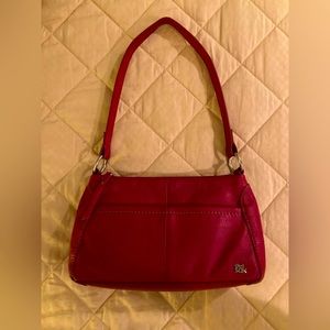 Classy Red The Sak Shoulder Purse. Great details. Plenty of pockets.